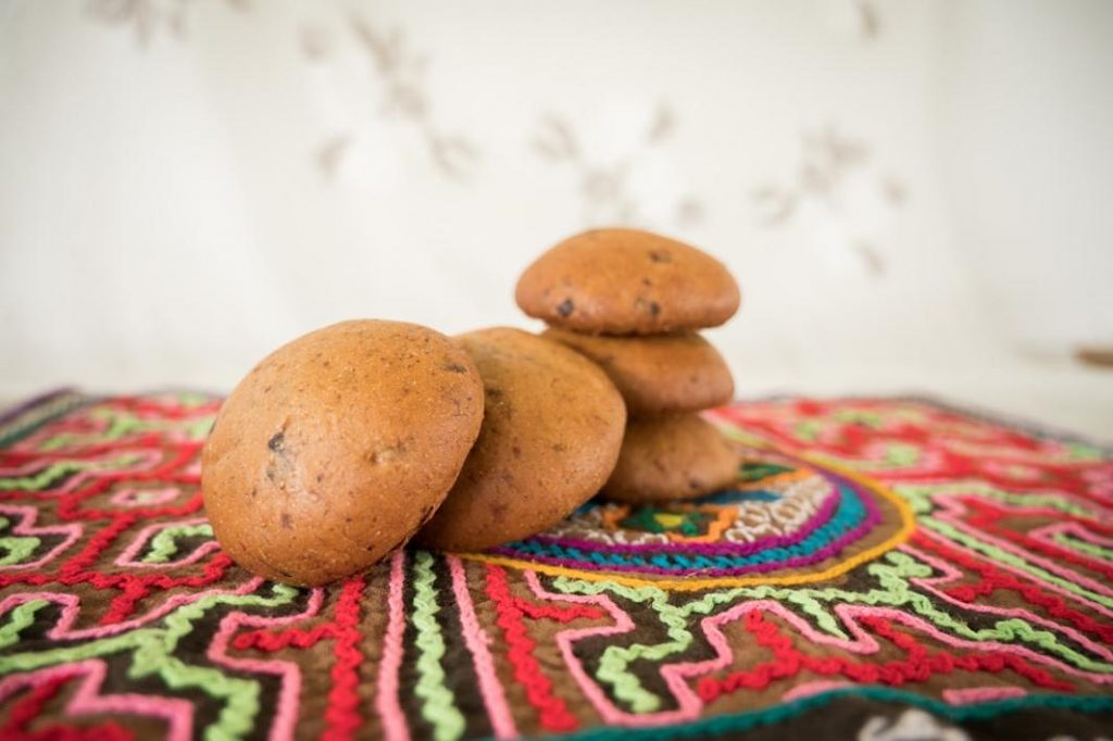 Traditional ghriba cookies made with almond flour and dusted with powdered sugar.