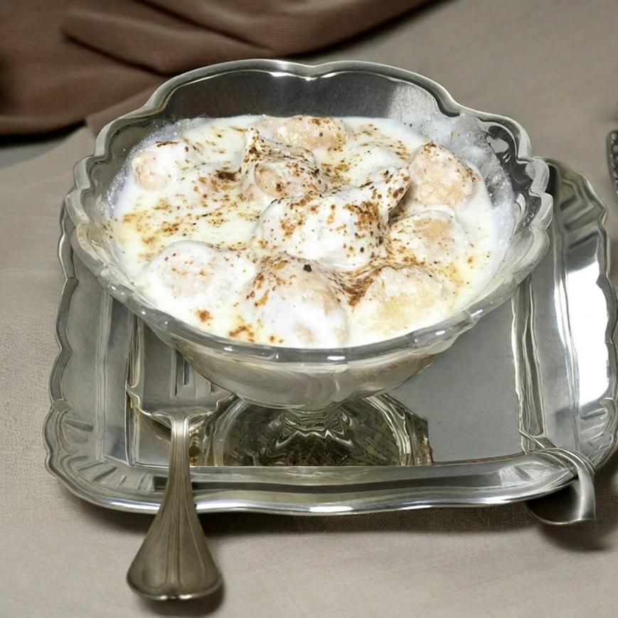 Knafeh dessert with pistachio topping on a plate